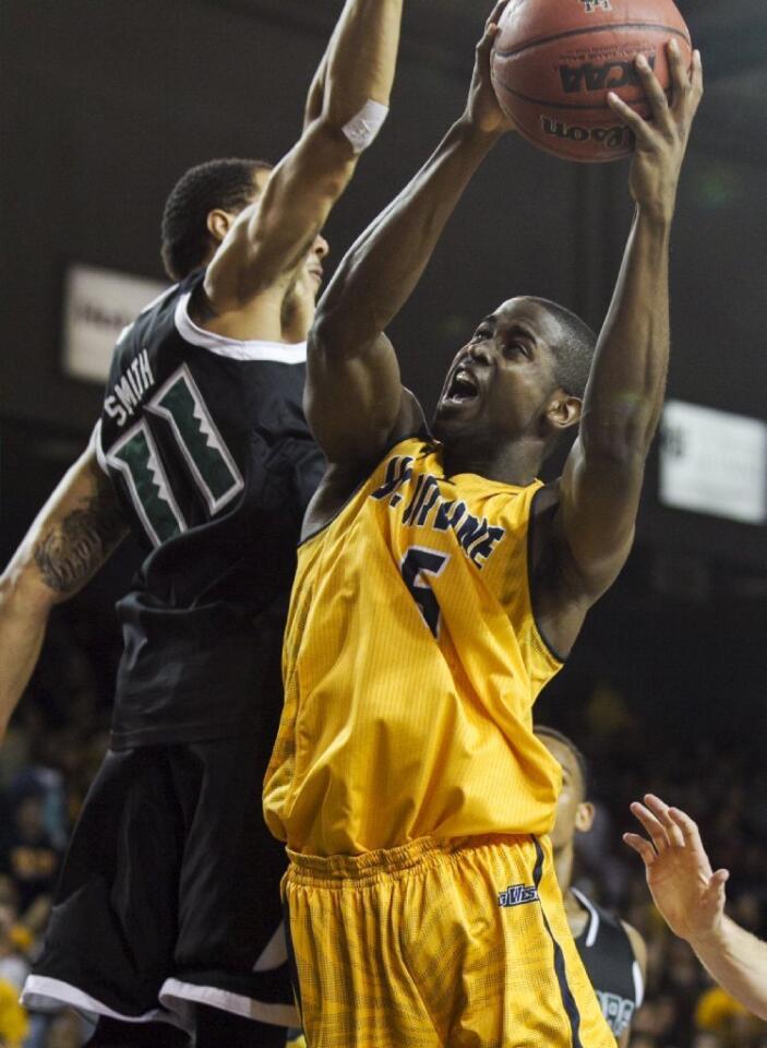UC Irvine's Chris McNealy goes up for a shot against Hawaii's Quincy Smith during a game on Saturday.