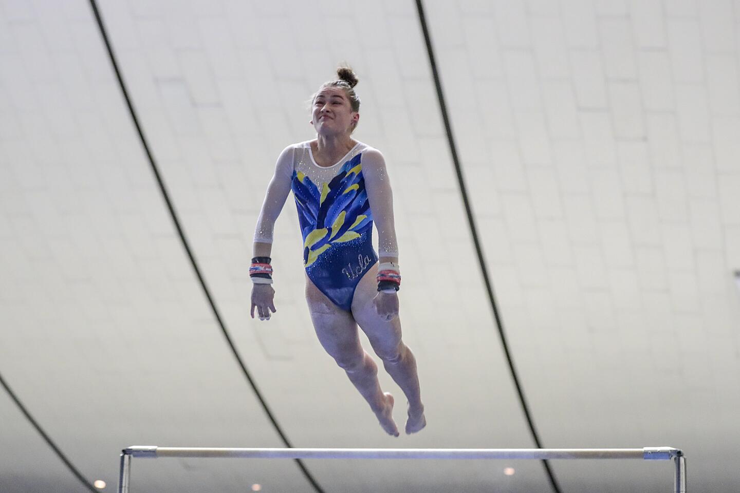 UCLA's Norah Flatley flies into her dismount during the bars competition at the Collegiate Challenge gymnastics meet at the Anaheim Convention Center.