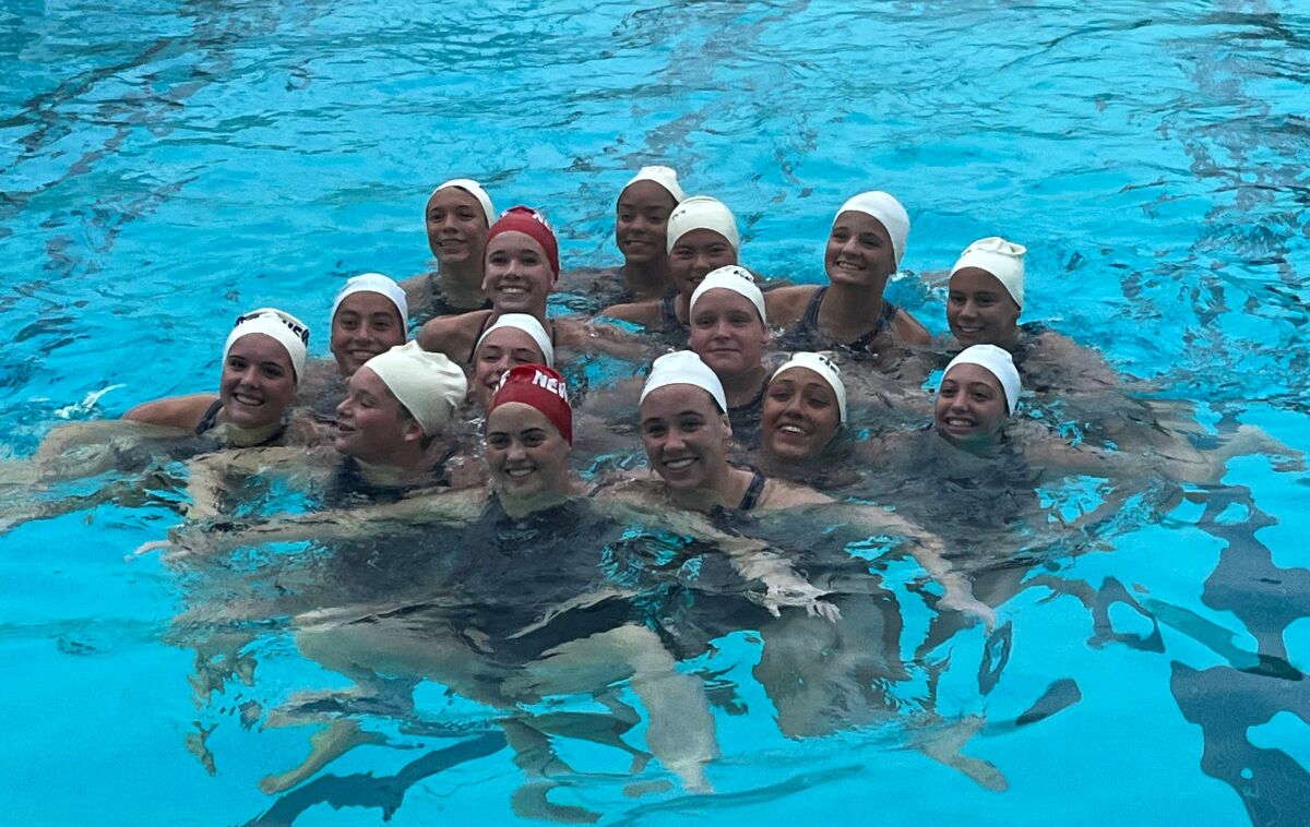 Members of the Newport Harbor High girls' water polo team are all smiles after winning a tournament.