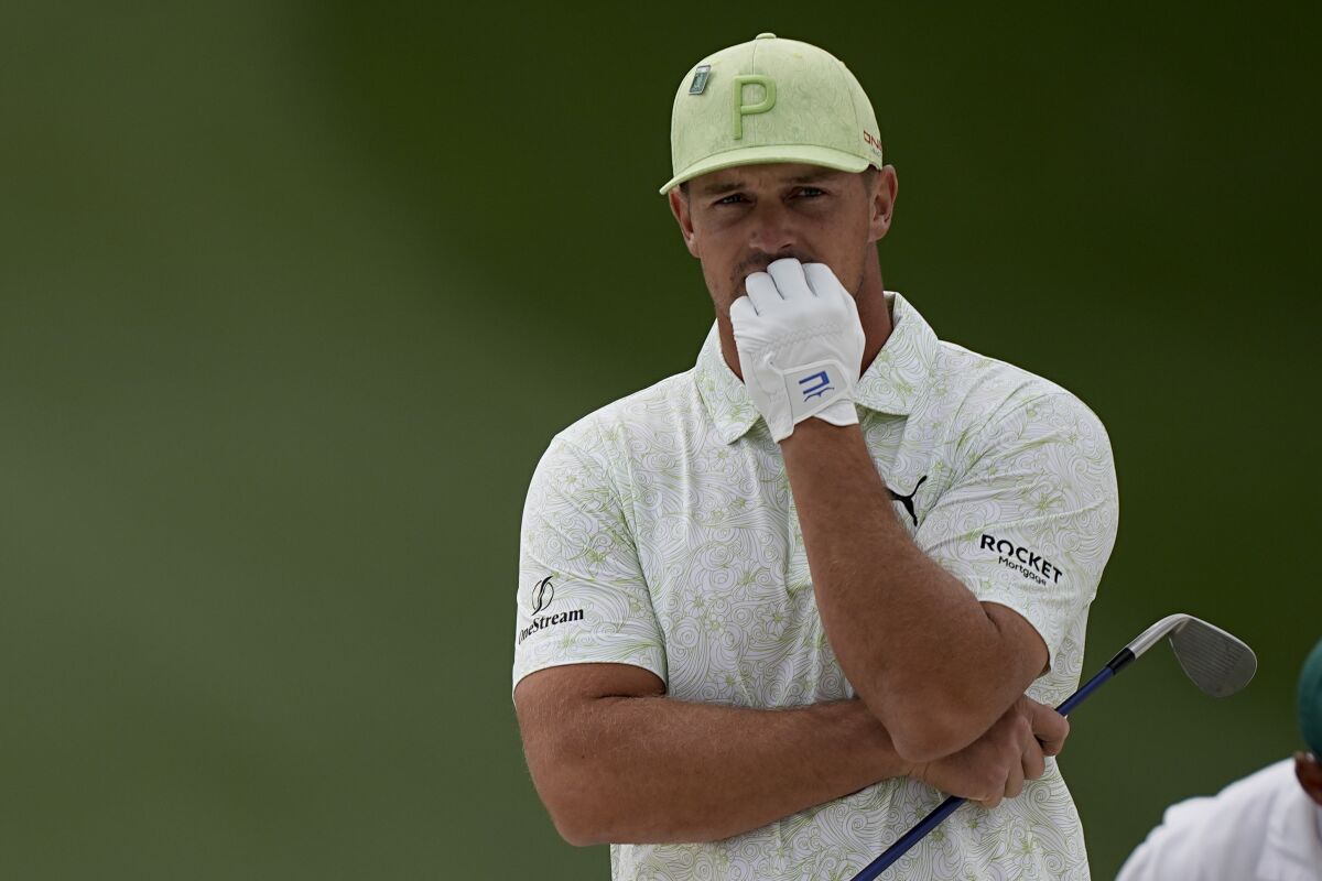 Bryson DeChambeau waits to take his shot to the seventh bunker during the second round at the Masters golf tournament on Friday, April 8, 2022, in Augusta, Ga. (AP Photo/David J. Phillip)
