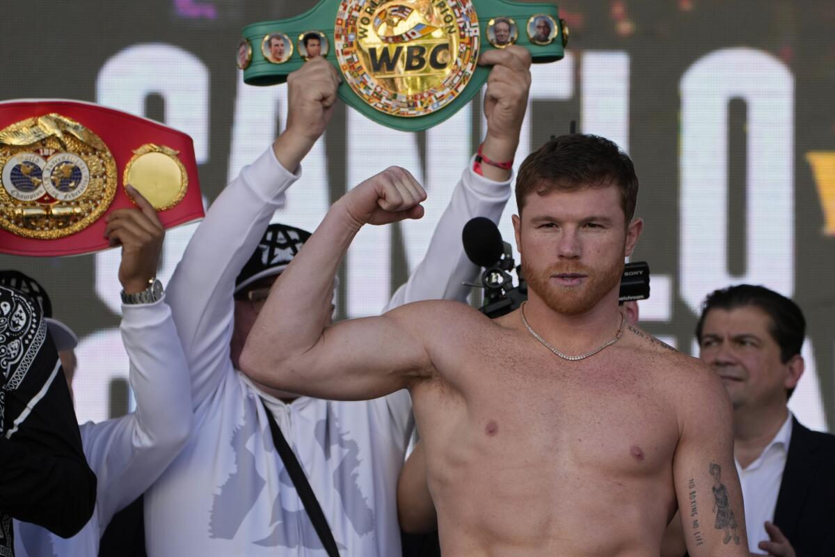 Canelo Álvarez stands on the scale during a ceremonial weigh-in Friday