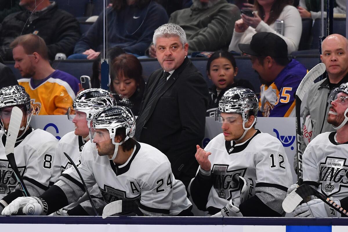 Kings coach Todd McLellan stands behind the bench during a game against the Columbus Blue Jackets on Dec. 5.