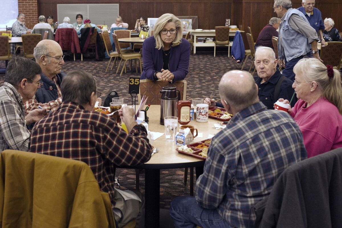 FILE - In this Feb. 1, 2016, file photo, Liz Cheney, center, talks to people at the Senior Citizens Center in Gillette, Wyo., after earlier in the day announcing she would run fro Congress. Removing congresswoman Liz Cheney from House GOP leadership was a relatively easy task for pro-Trump Republicans compared to their growing effort to boot her from office. (Ed Glazar/Gillette News Record via AP)