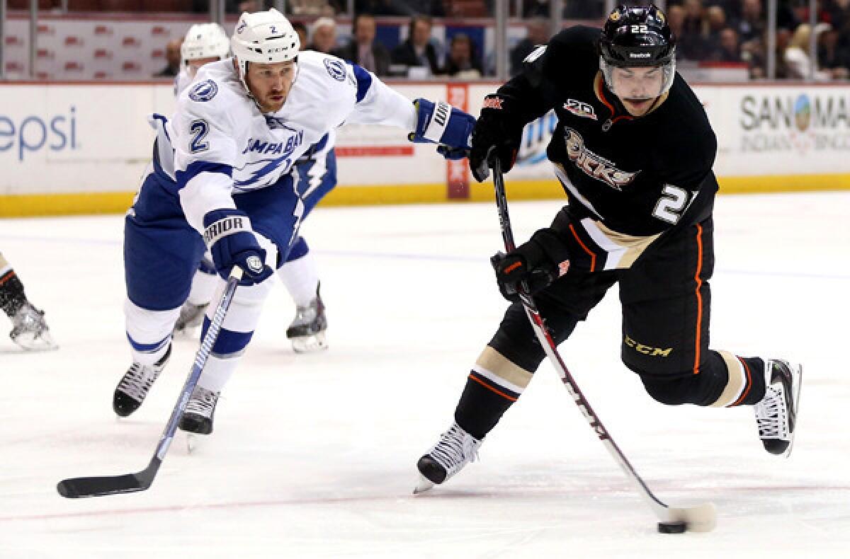Ducks center Mathieu Perreault fires a shot past Lightning defenseman Eric Brewer during a game last month. Perreault hasn't scored a goal in the last 15 games he's appeared in.