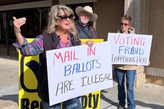 Recall supporter Patty Plumb (front) stands in front of the Shasta County Clerk's Office.