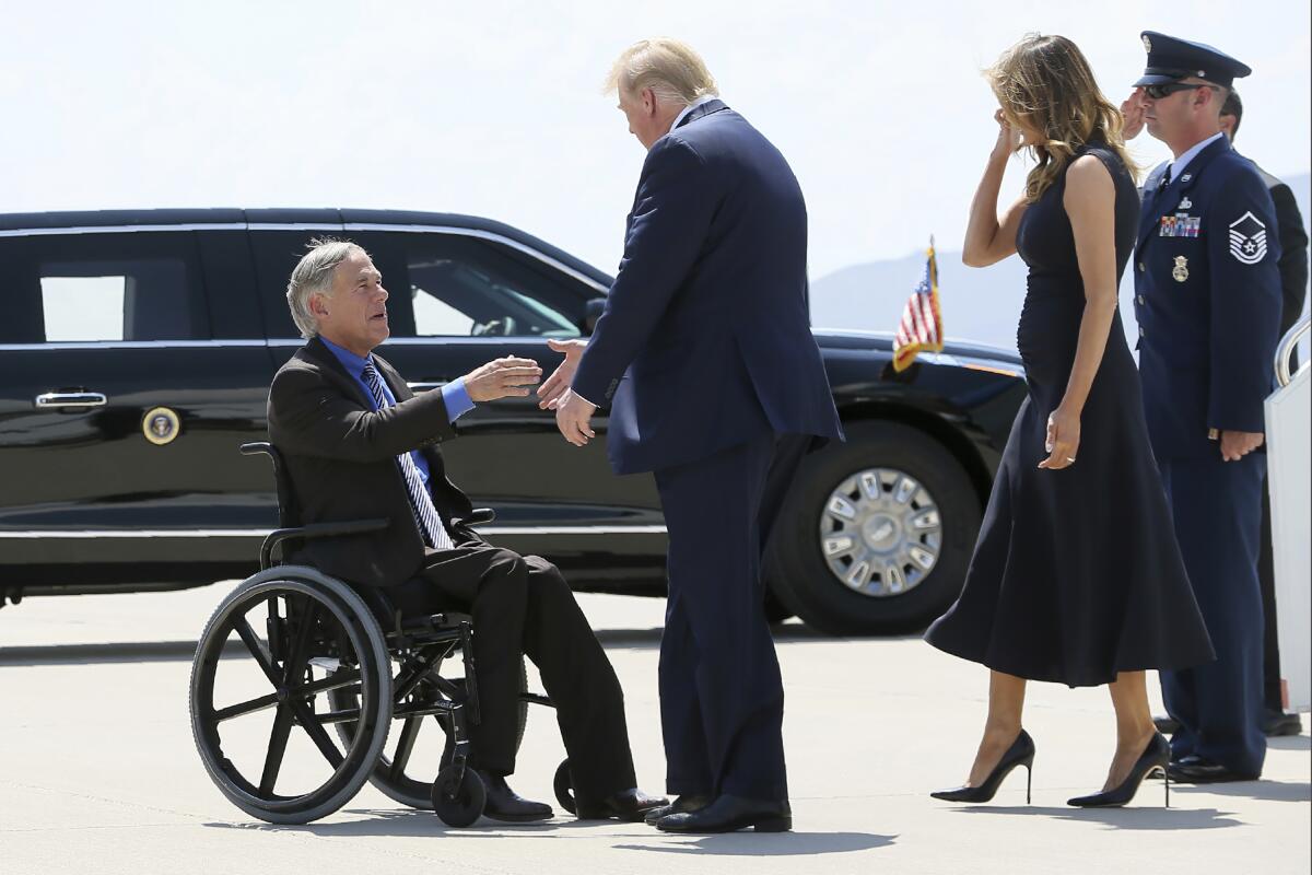 President Trump and Melania Trump greet Texas Gov. Greg Abbott in August.