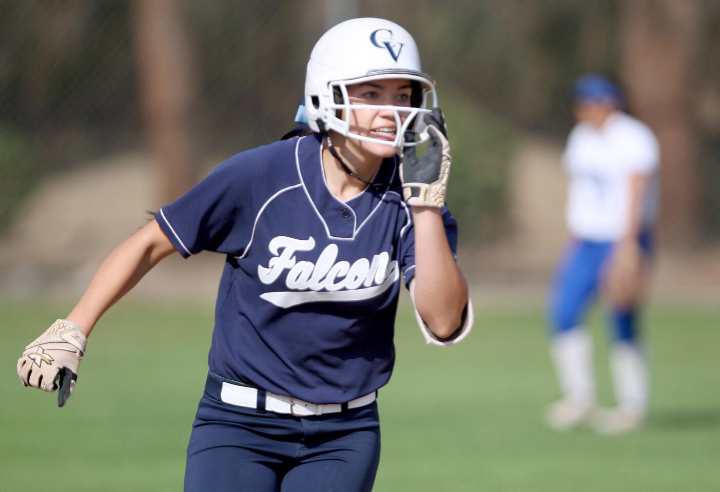 Crescenta Valley High School softball player #8 Sydney Wells rounds second base after hitting a round-tripper in away game vs. Burbank High School at the Bulldogs field in Burbank on Thursday, April 14, 2016. CVHS won 14-3 in 5 innings.
