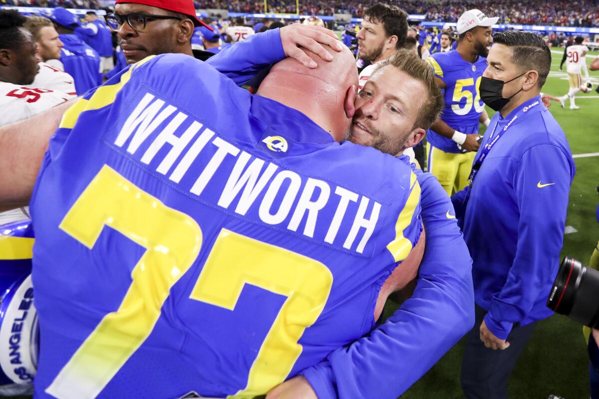 Rams head coach Sean McVay hugs offensive tackle Andrew Whitworth following the NFC championship game Jan. 20 at SoFi Stadium