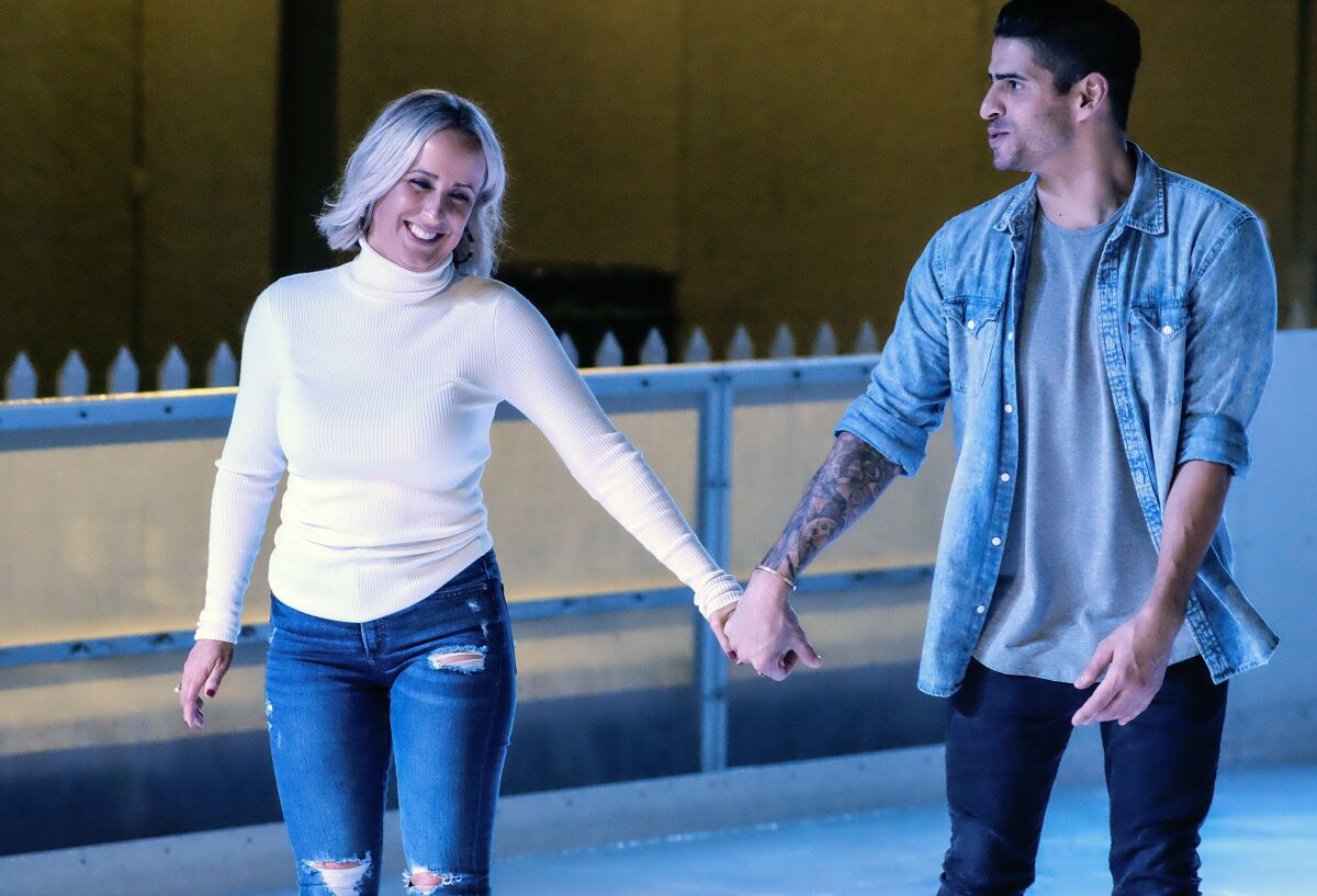 Logan and Katlyn enjoy a romantic evening at the Rady Children’s Ice Rink at Liberty Station.