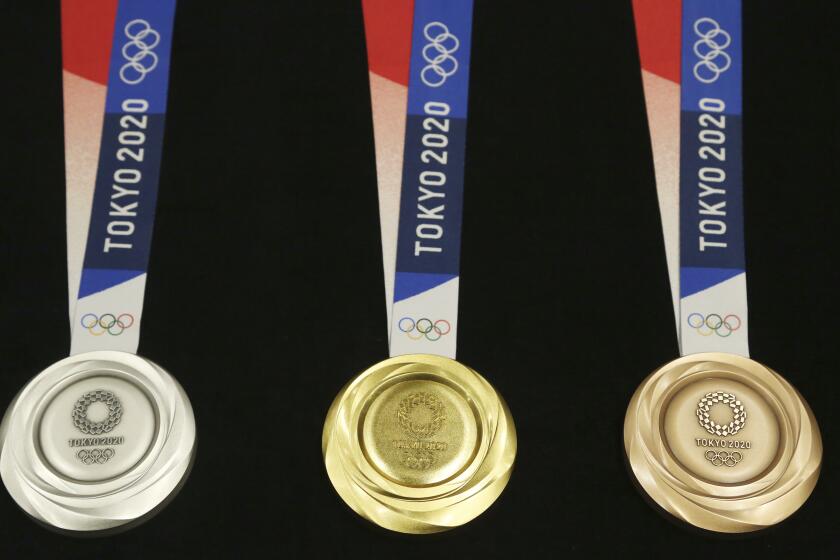 The 2020 Olympic medals were unveiled during a ceremony Wednesday in Tokyo.