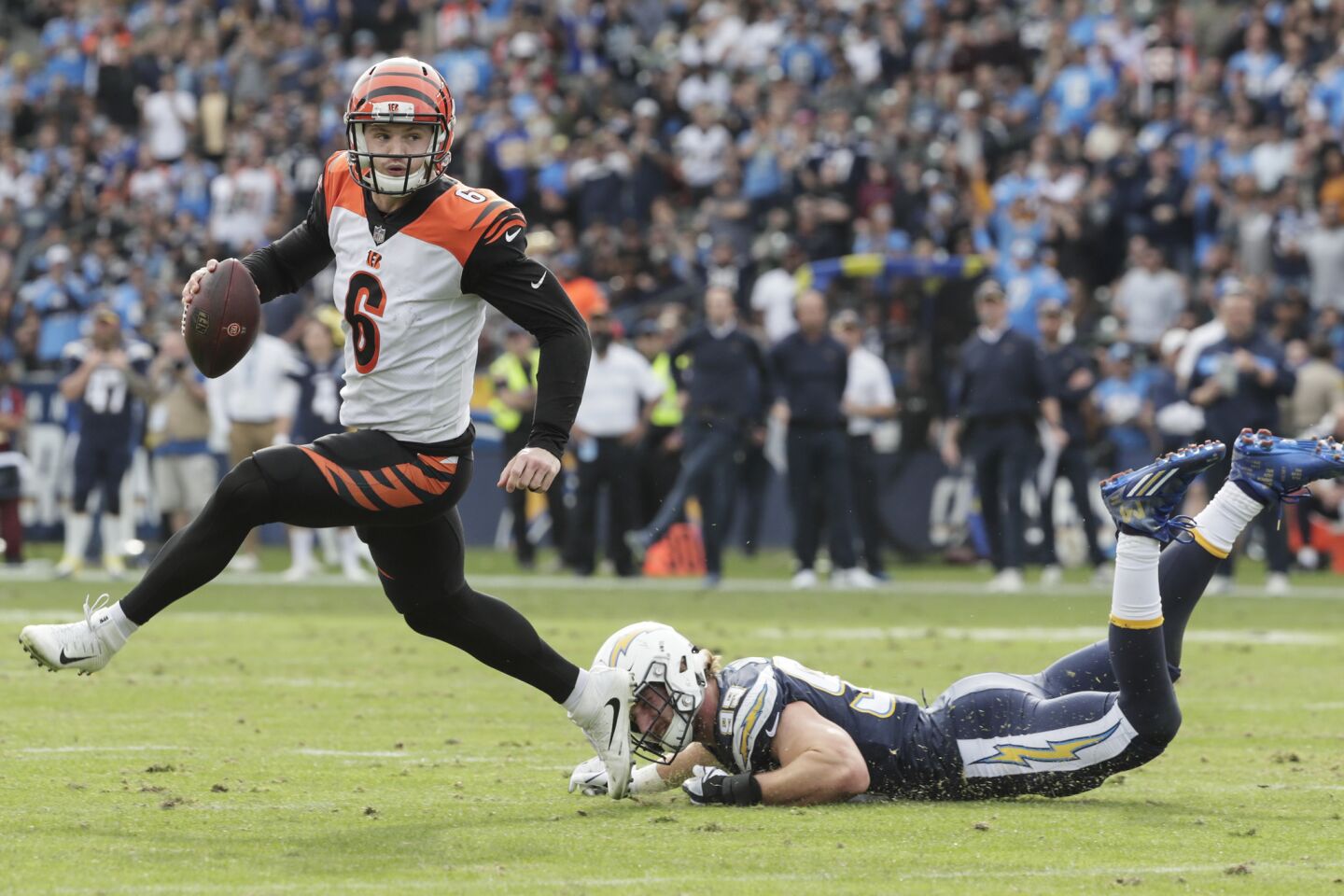 Bengals quarterback Jeff Driskel slips past Chargers defensive end Joey Bosa during a drive in second quarter.