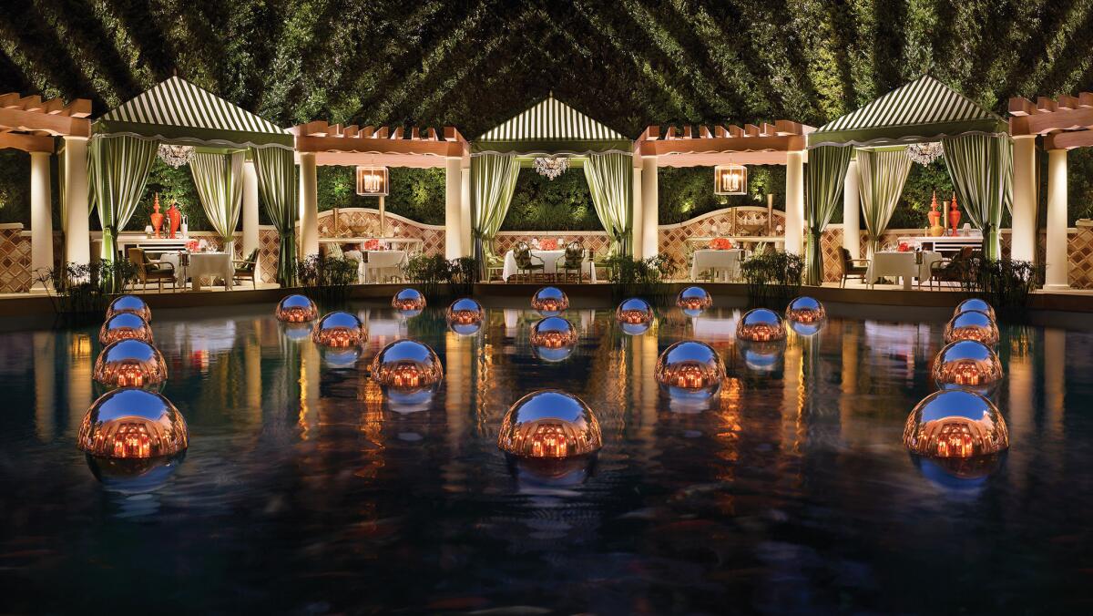 Diners can opt to dine al fresco in outdoor cabanas beside a dramatically decorated koi pond at Costa di Mare. Heat lamps are provided during the chilly season, and misters keep things cooler in summer. (Barbara Kraft)