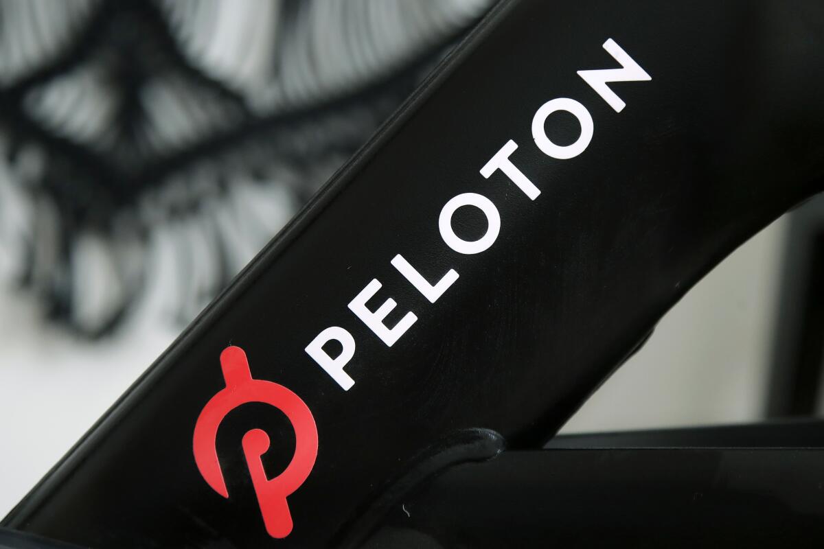 A Peloton logo on the company's stationary bicycle