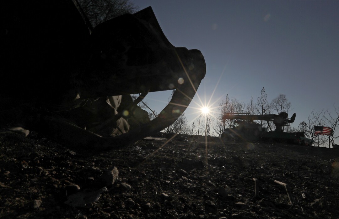 Burned hulk of a car along Lake Oroville
