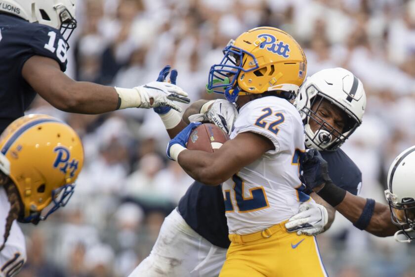 Penn State linebacker Micah Parsons (11) tackles Pittsburgh running back Vincent Davis (22) in the second quarter of an NCAA college football game in State College, Pa., on Saturday, Sept. 14, 2019. (AP Photo/Barry Reeger)