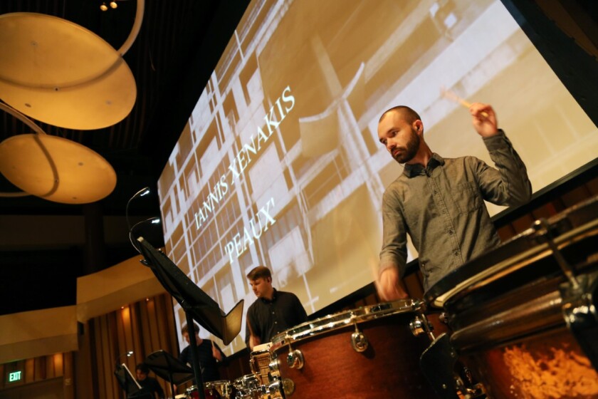 Derek Tywoniuk, foreground, with Dustin Donahue (obscured), Eric Derr and Jonathan Hepfer playing Xenakis during the Monday Evening Concert at Zipper Hall.