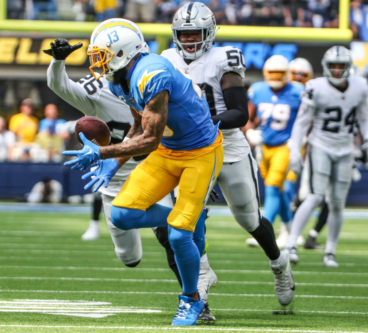 Chargers wide receiver Keenan Allen hauls in a pass from Justin Herbert during the first quarter.