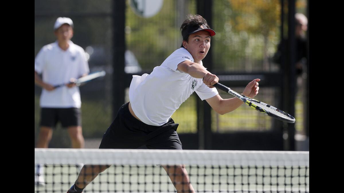 Sage Hill School's Robert Gerschultz, right, scores as No. 1 doubles teammate Adam Hung looks on against Chino Hills Ayala during the first round of the CIF Southern Section Division 1 playoffs in Newport Beach on Wednesday.