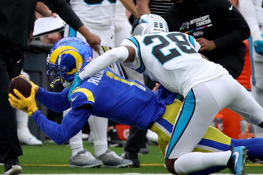 Rams receiver Allen Robinson III makes a catch in front of Carolina cornerback Keith Taylor Jr. 