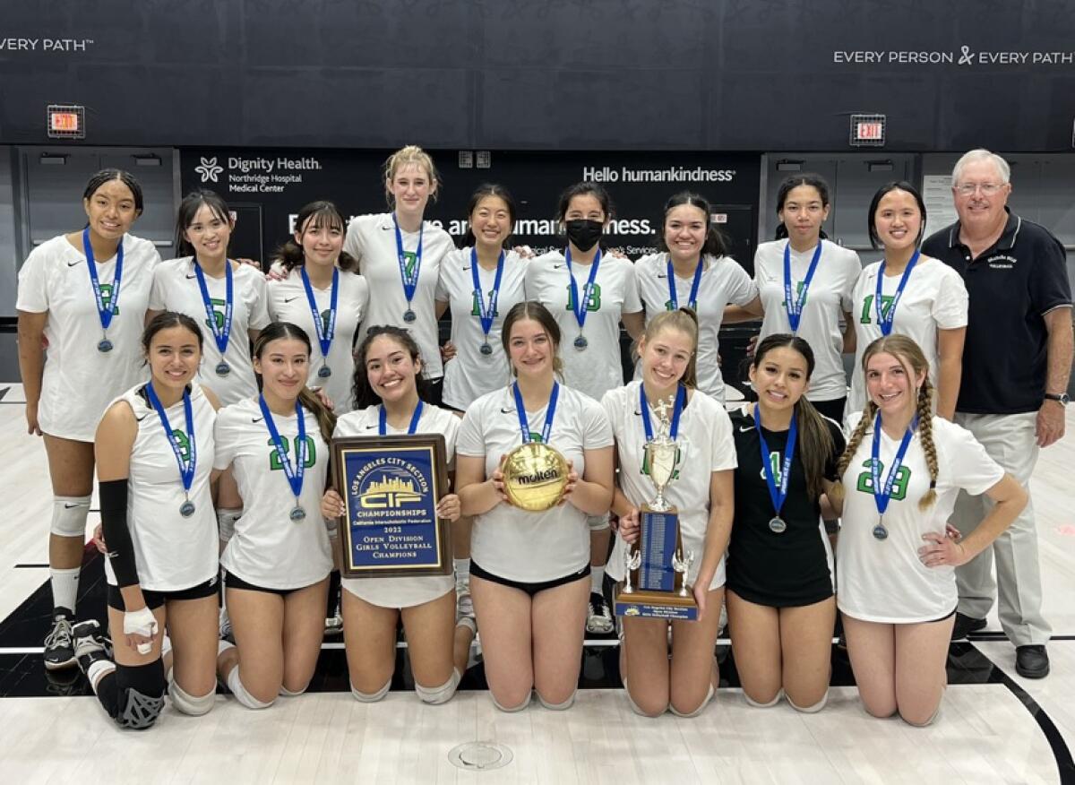 The Granada Hills Highlanders pose with a trophy after winning the City Section title.