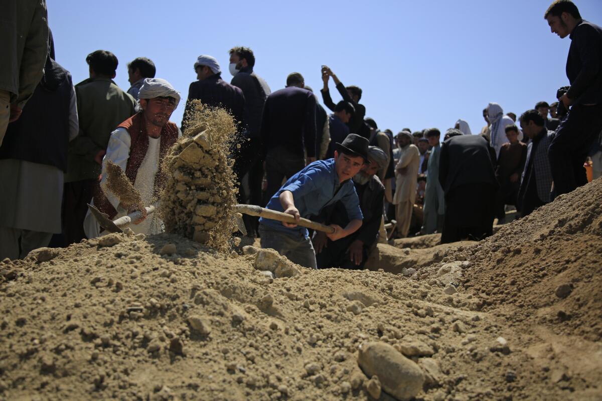 Burial of bombing victim near Kabul, Afghanistan