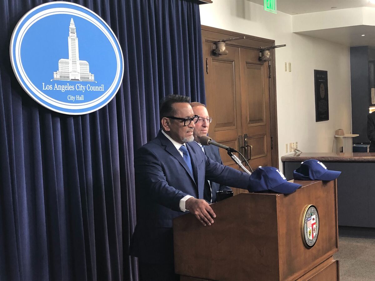 L.A. City Councilmen Gil Cedillo, left, and Paul Koretz speak to reporters before Tuesday's vote calling on Major League Baseball to award the Dodgers the 2017 and 2018 World Series championships. 