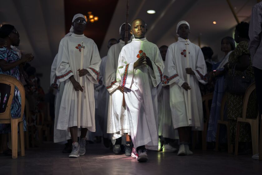 Morning service concludes in the annex of the Cathedral Notre Dame du Congo in Kinshasa, Democratic Republic of the Congo, Sunday Jan. 29, 2023. The cathedral is being prepared for Pope Francis' visit to Congo and South Sudan for a six-day trip starting Jan, 31, hoping to bring comfort and encouragement to two countries that have been riven by poverty, conflicts and what he calls a "colonialist mentality" that has exploited Africa for centuries. (AP Photo/Jerome Delay)