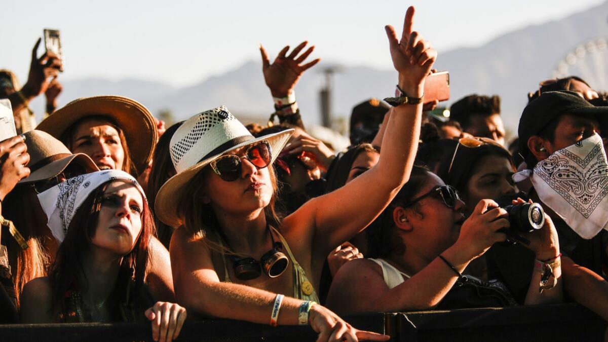 Fans of Cardi B rap along during her performance at the 2018 Coachella Valley Music and Arts Festival.