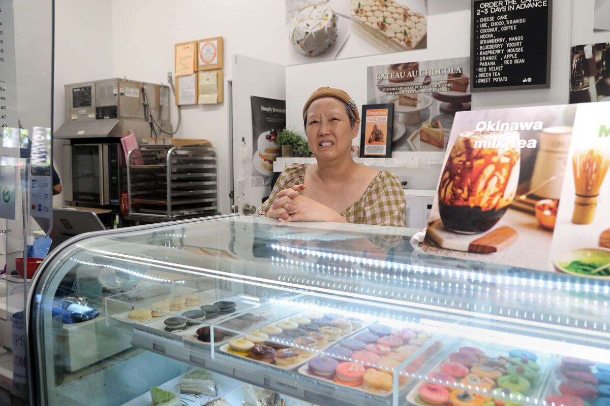 Owner Chong Bok Manalo behind the counter at Braga, located in the Union Market.