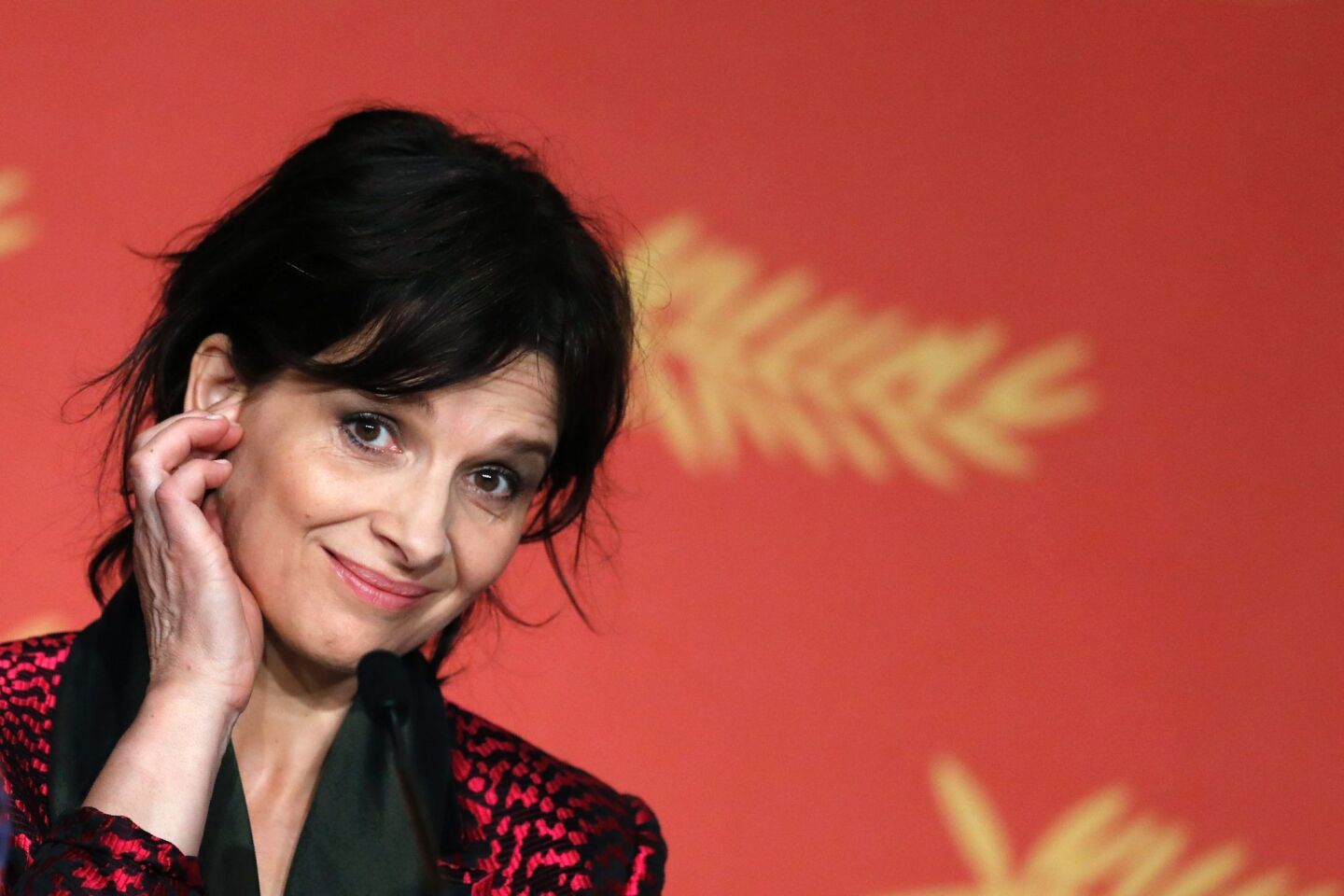 Juliette Binoche smiles during a Cannes Film Festival news conference for "Ma Loute (Slack Bay)" on May 13.