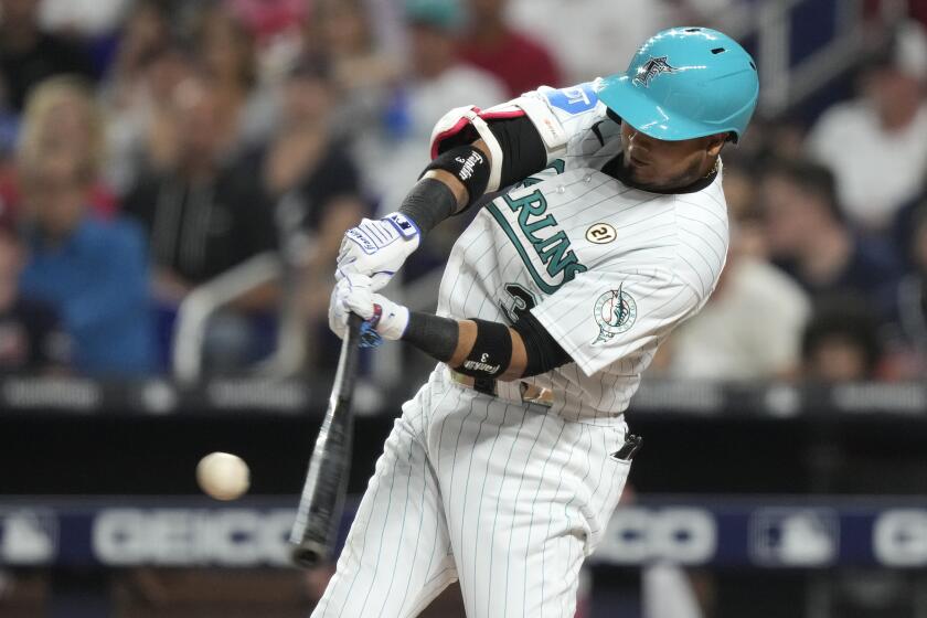 Miami Marlins' Luis Arraez hits a solo home run during the first inning of a baseball game against the Atlanta Braves, Friday, Sept. 15, 2023, in Miami. (AP Photo/Lynne Sladky)