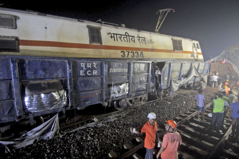 Rescuers work at the site of passenger trains accident, in Balasore district, in the eastern Indian state of Orissa, Saturday, June 3, 2023. Two passenger trains derailed in India, killing more than 200 people and trapping hundreds of others inside more than a dozen damaged rail cars officials said. (AP Photo)