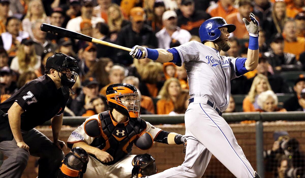 Royals left fielder Alex Gordon delivers a run-scoring double against the Giants in Game 3 of the World Series on Friday night in San Francisco.