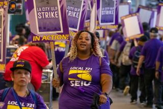 LOS ANGELES, CA - AUGUST 08: Joycette Herndon, a bus operator at LAX, joins Los Angeles city workers picket lines Tuesday, August 8, 2023, at LAX in Los Angeles, CA. (Irfan Khan / Los Angeles Times)