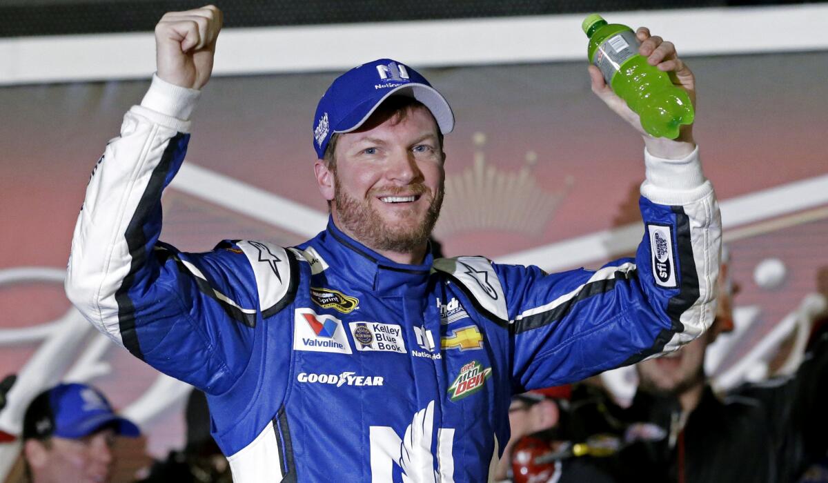 NASCAR driver Dale Earnhardt Jr. celebrates after winning the first of two qualifying races for the Daytona 500 on Thursday night.