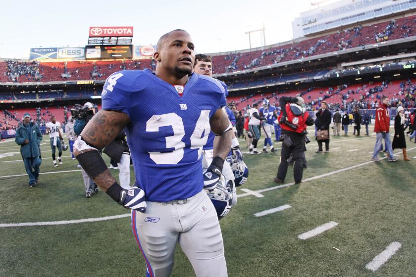 Giants running back Derrick Ward walks off the field after a 23-11 loss to the Eagles.