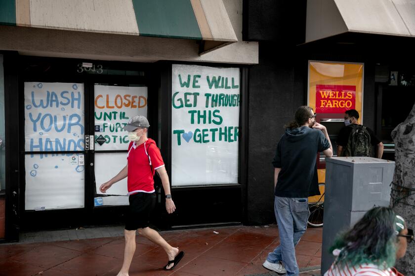 A boutique is shut down on University Avenue, immediately next to a Wells Fargo ATM on May 28, 2020 in San Diego, California.