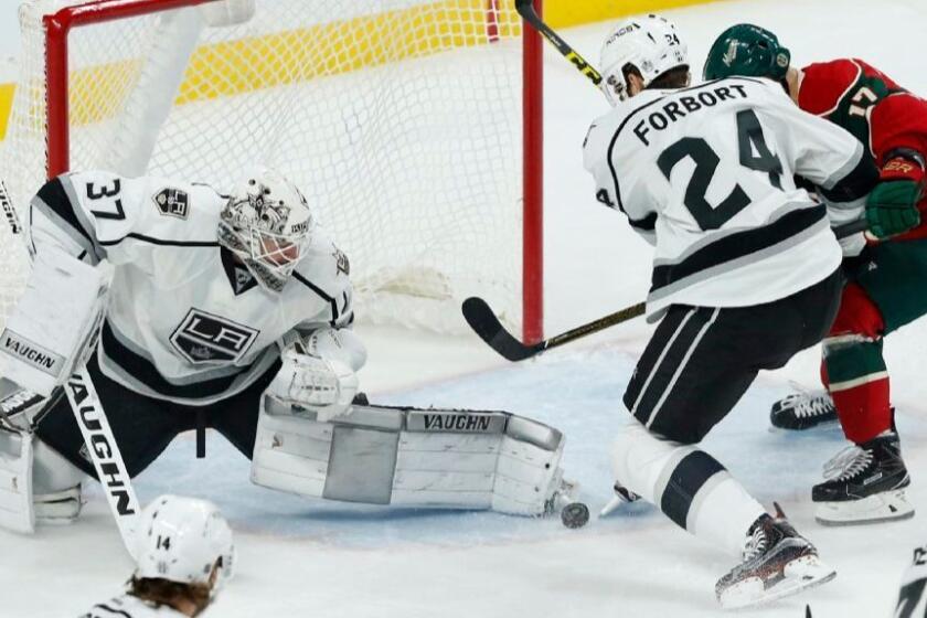 Kings goaltender Jeff Zatkoff stops a shot during a game against the Wild on Oct. 18.