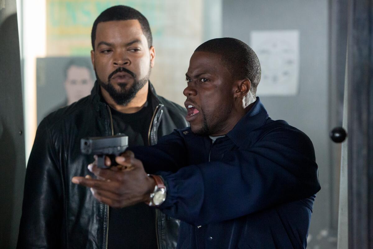 Ice Cube, left, and Kevin Hart in a scene from "Ride Along."
