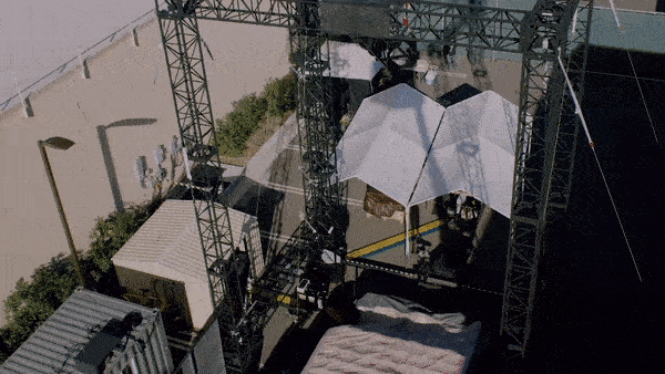 A moving image of a robot stunt double rotating through the air