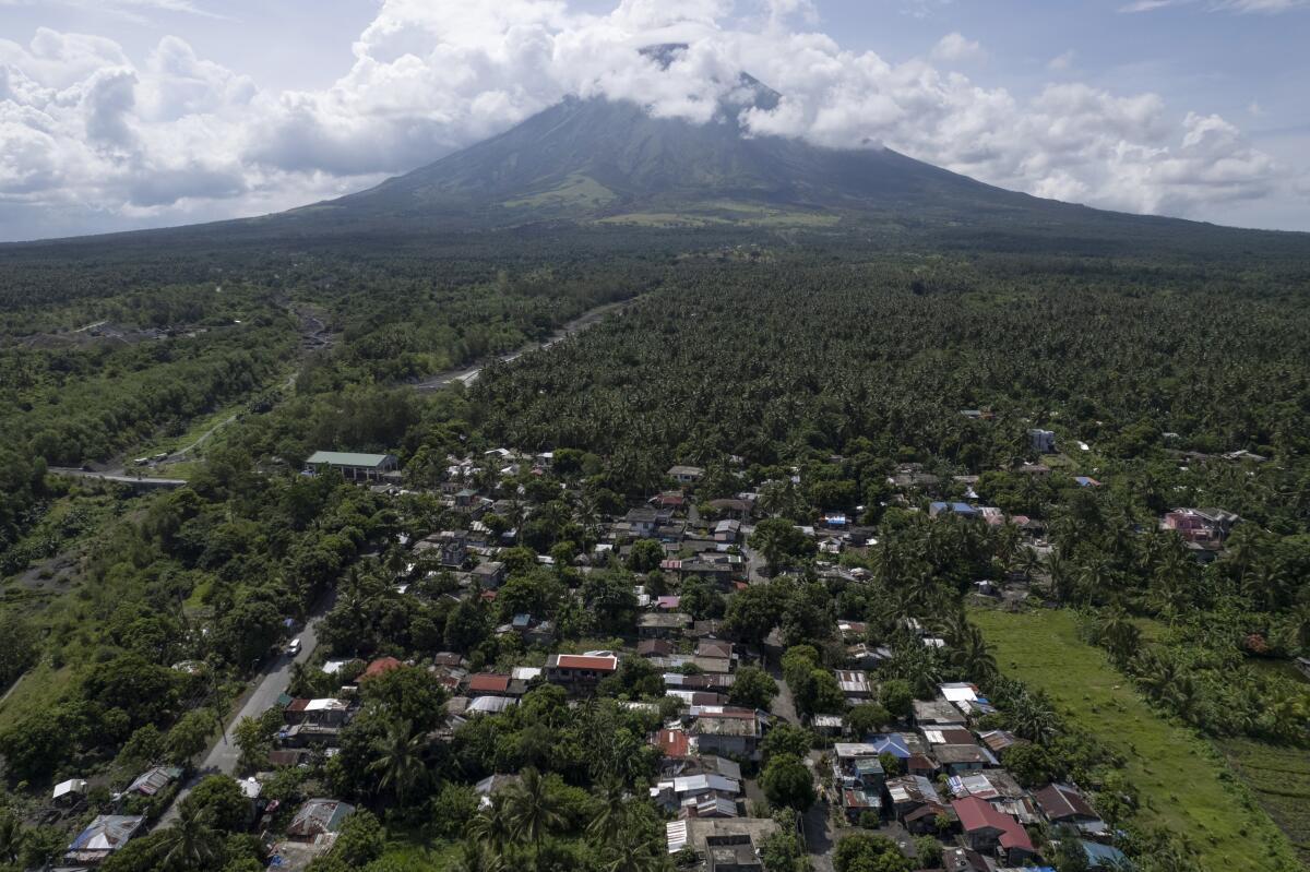 Homes set against backdrop of the Philippines' Mayon volcano