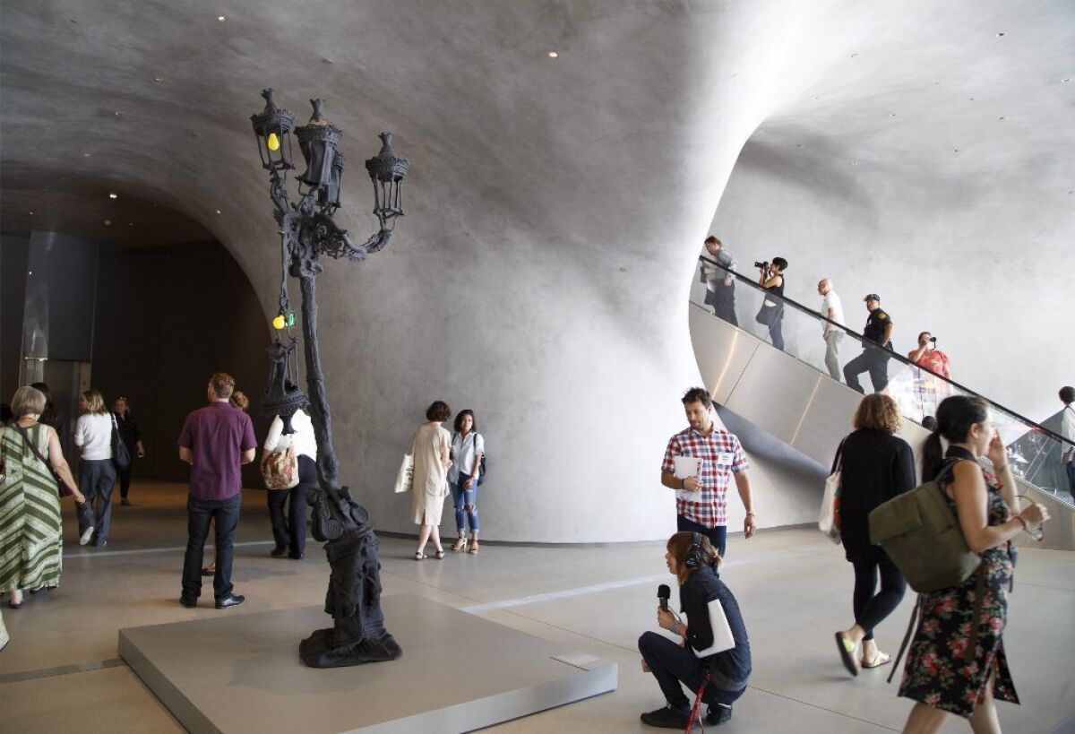Urs Fischer's streetlight sculpture "Untitled, 2012" stands in the lobby of the new Broad museum in downtown Los Angeles.