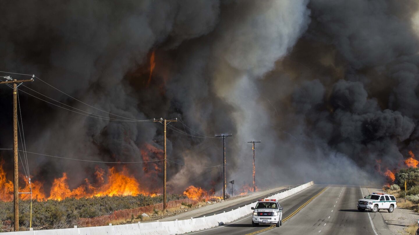 The Blue Cut fire burns out of control on both sides of Highway 138 in Summit Valley, California.