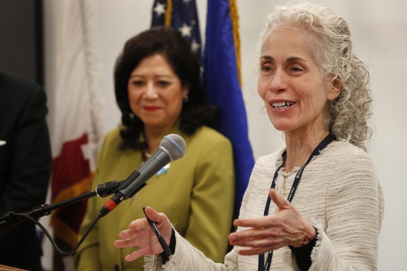 LOS ANGELES, CA - May 1, 2018: Dr. Barbara Ferrer, PhD, MPH, MEd, right, recently appointed the new Los Angeles County public health director by the Los Angeles County Board of Supervisors at a press conference on May 1, 2018 for the Los Angeles Reproductive Health Equity Project for Foster Youth (LA RHEP), funded by the Conrad N. Hilton Foundation which is a new public-private partnership serving LA County and constituents. LA RHEP brings together County departments, foster youth, and the agencies that serve them to promote evidence-informed strategies that reduce unplanned pregnancies and dismantle systemic barriers to health education and services for youth in foster care. Last year, Supervisor Solis, joined by Supervisor Sheila Kuehl, introduced a motion directing County departments to align with and participate in LA RHEP. The goal is to dramatically reduce unintended pregnancy rates for youth in care over the next ten years. (Al Seib / Los Angeles Times)