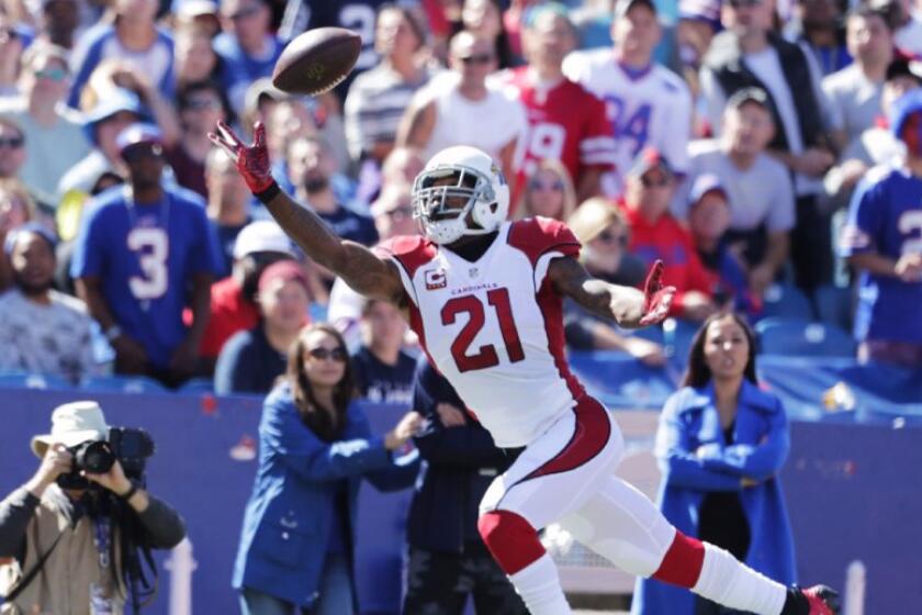 Cardinals cornerback Patrick Peterson reaches out to make a one-handed interception of Bills quarterback Tyrod Taylor during a game on Sept. 25.