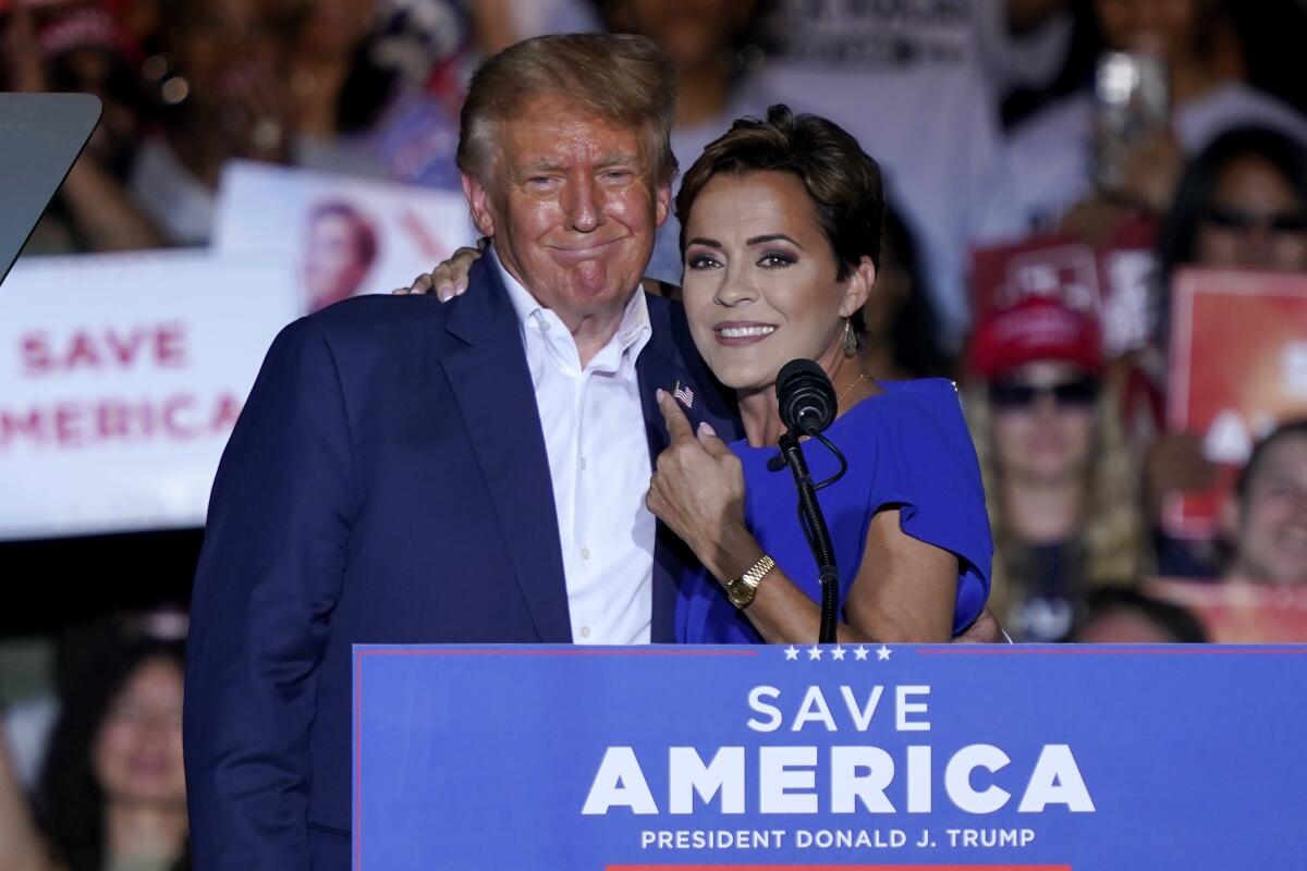 Kari Lake, shown with former President Trump at a rally in October 2022.