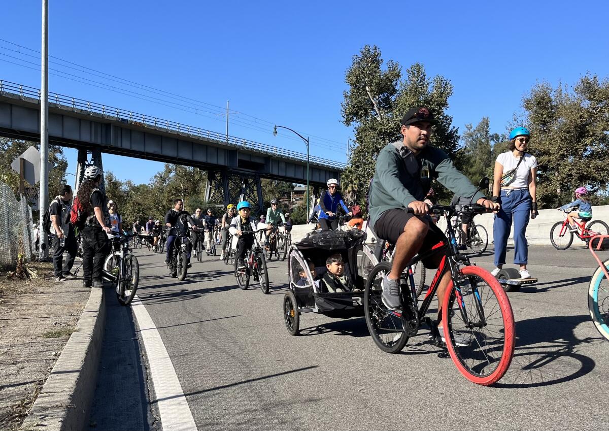 People riding bikes on a freeway