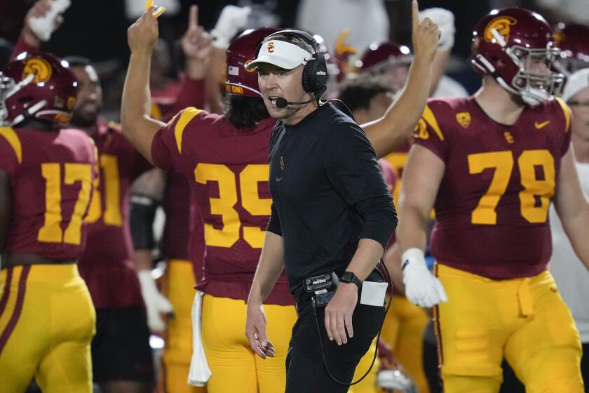 Southern California head coach Lincoln Riley walks on the sideline during the first half.