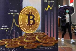 FILE - An advertisement for Bitcoin cryptocurrency is displayed on a street in Hong Kong on Feb. 17, 2022. Cryptocurrencies have experienced their worst plunge since 2018. As prices drop, companies collapse and skepticism soars, fortunes and jobs are disappearing overnight, and investors’ feverish speculation has been replaced by icy calculation, in what industry leaders are referring to as a “crypto winter.” (AP Photo/Kin Cheung, File)