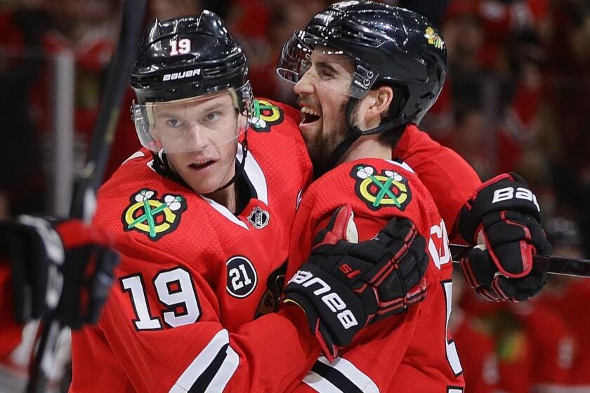 CHICAGO, ILLINOIS - FEBRUARY 24: Jonathan Toews #19 and Erik Gustafsson #56 of the Chicago Blackhawks celebrate Toews' power play goal in the third period against the Dallas Stars at the United Center on February 24, 2019 in Chicago, Illinois. The Stars defeated the Blackhawks 4-3. (Photo by Jonathan Daniel/Getty Images) ** OUTS - ELSENT, FPG, CM - OUTS * NM, PH, VA if sourced by CT, LA or MoD **
